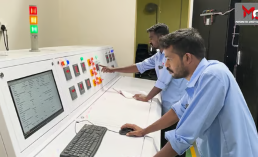 Engineers monitoring the transformer testing control panel